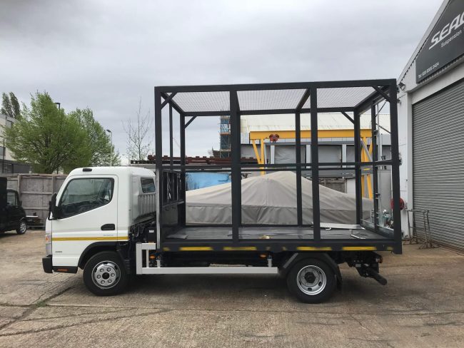 IMG_1545 White lorry with large cage on the back for household rubbish