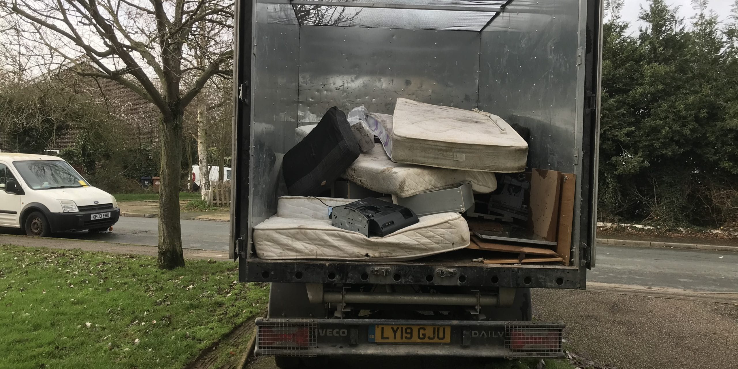 IMG_1720 Large van with dirty mattresses piled up in the back