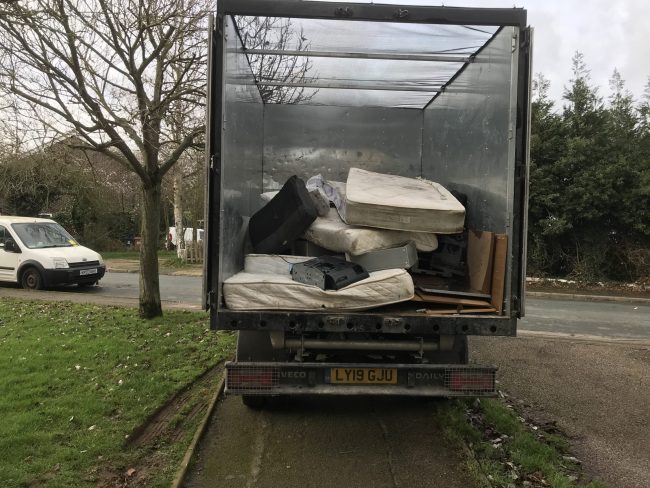 IMG_1720 Large van with dirty mattresses piled up in the back