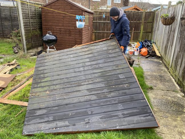 IMG_1836 Old fence being taken down by man in back garden