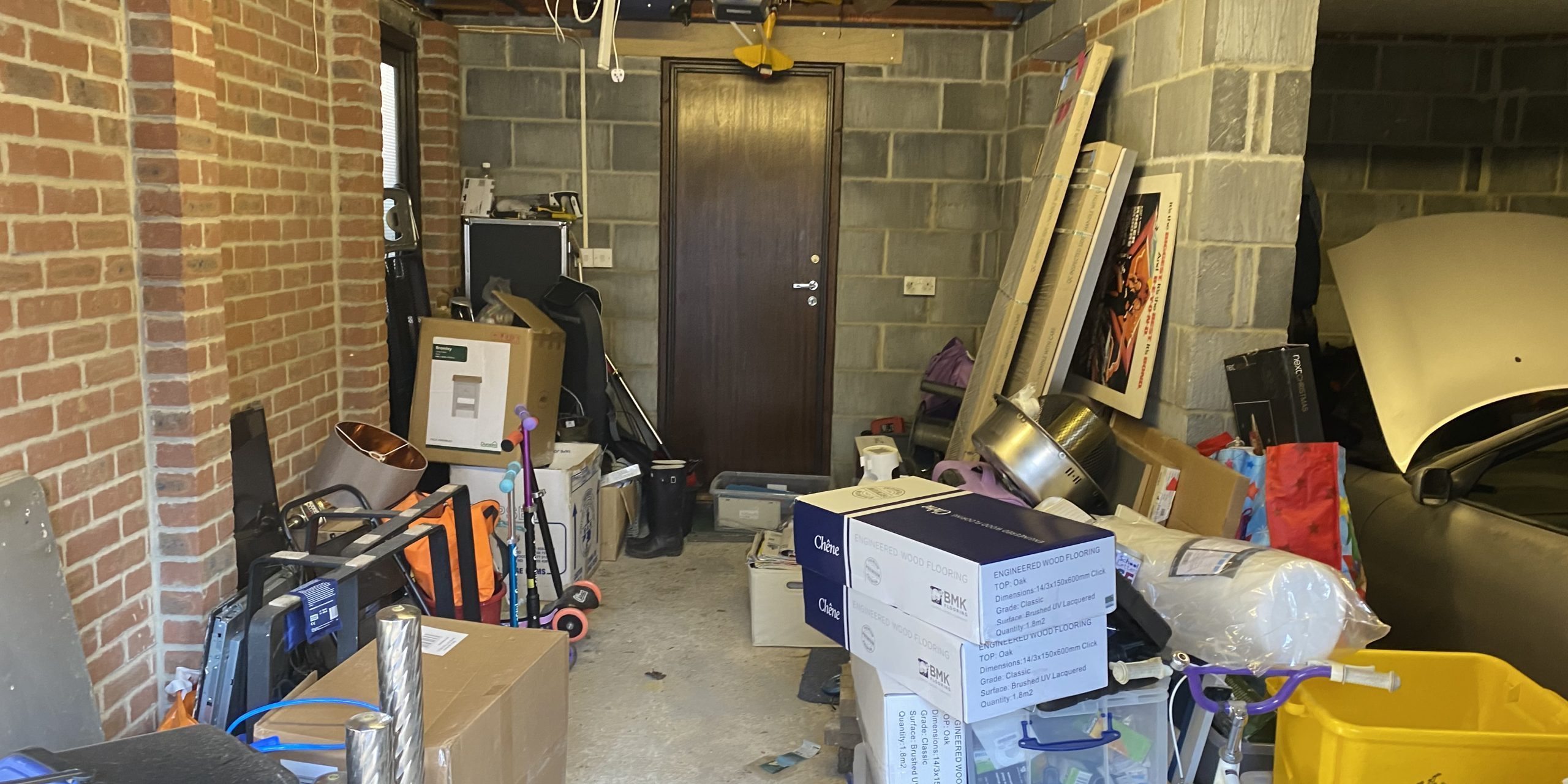IMG_4234 Garage cluttered with household rubbish with car and bike