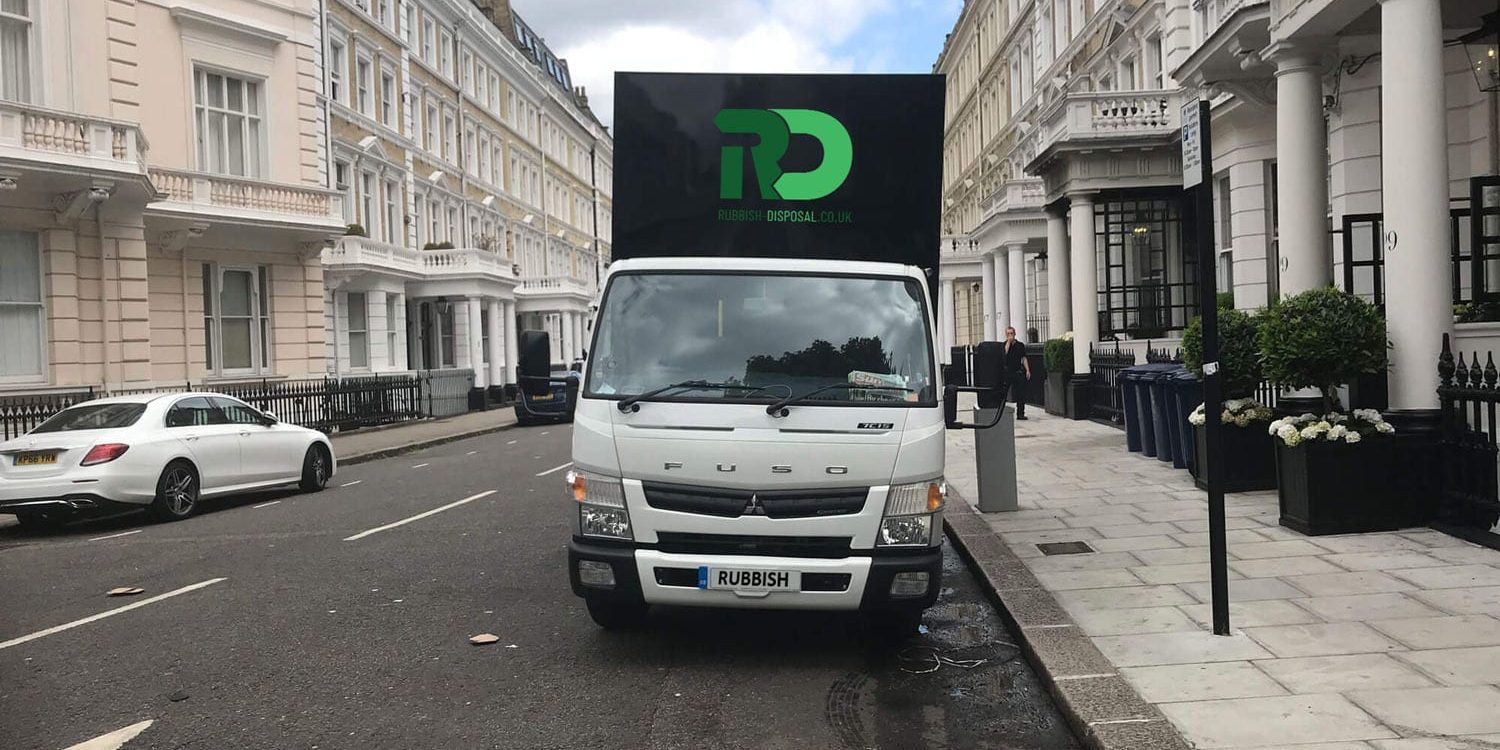 van-rebranded Rubbish Disposal van parked on London street