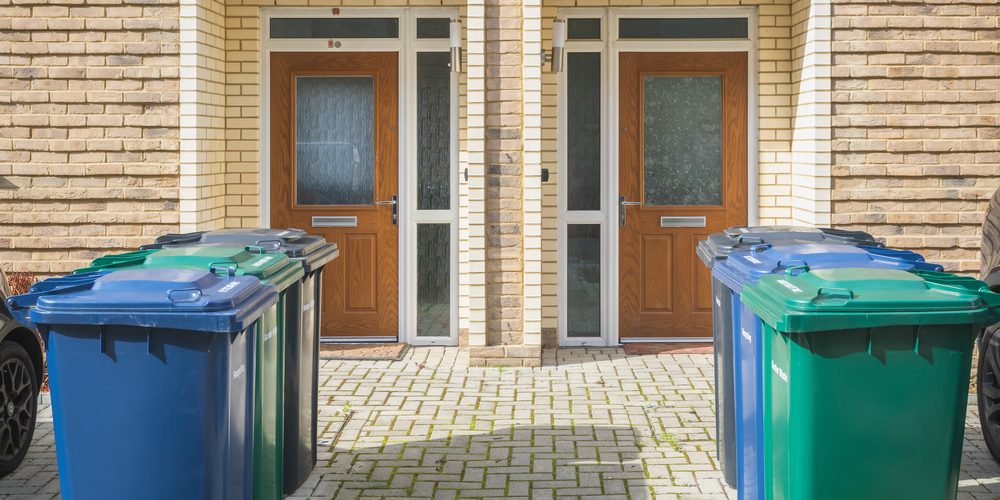 Wheelie,Bins,Outside,The,Front,Doors,,Labelled,For,Recycling,,Garden Using the Correct Waste Management Methods to Prevent Pests