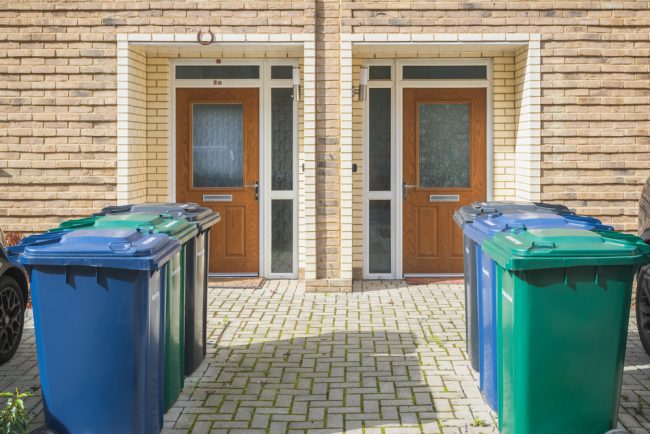 Wheelie,Bins,Outside,The,Front,Doors,,Labelled,For,Recycling,,Garden Using the Correct Waste Management Methods to Prevent Pests