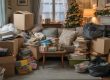 Cluttered living room filled with bags, boxes and old items before Christmas, showing a home in need of rubbish clearance