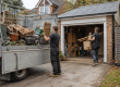 Rubbish clearance team removing unwanted items from a garage in Essex before winter